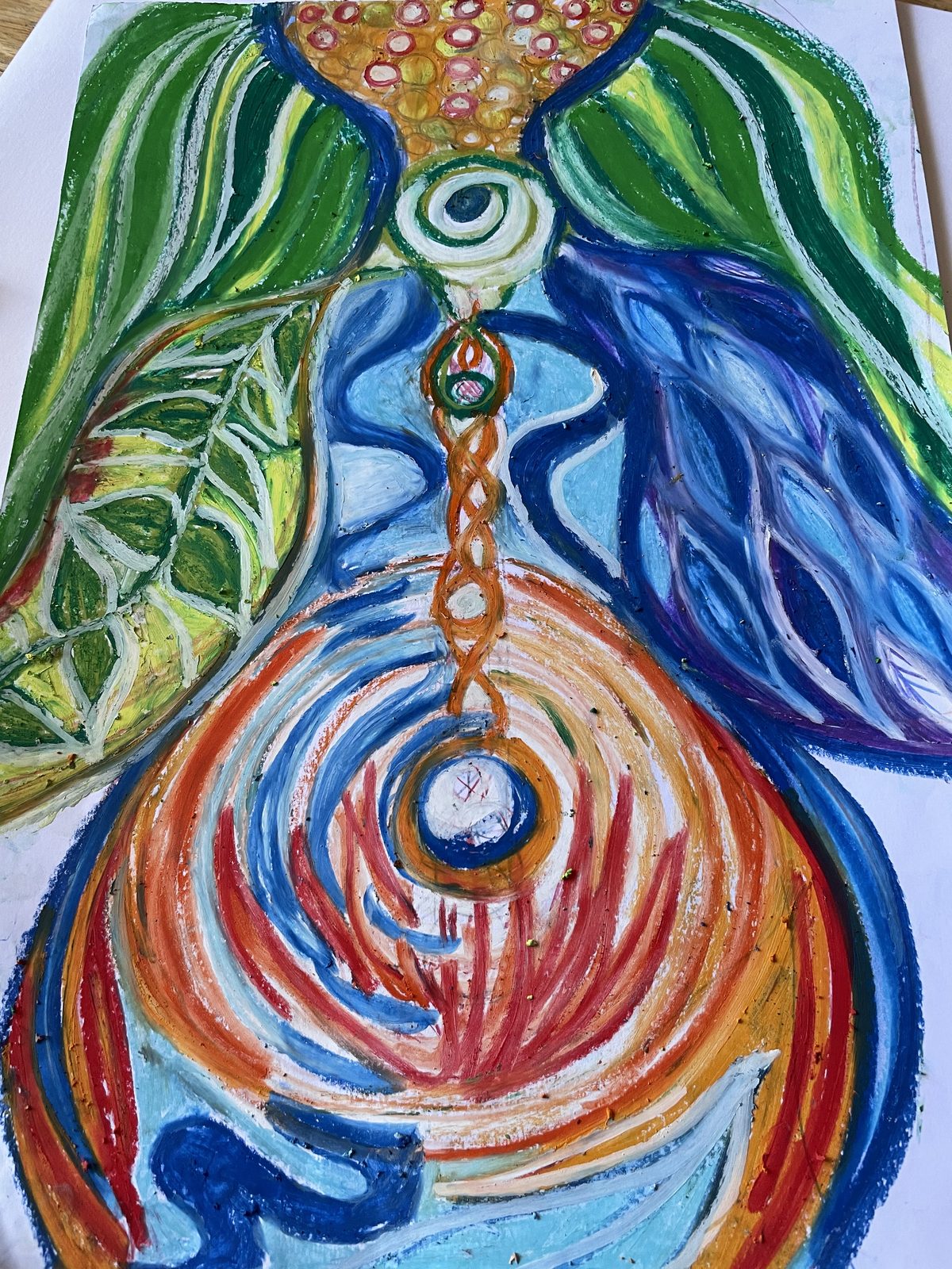 A self-portrait by Danielle in oil pastel: a figure of green leaves, blue water and a red spiral at the belly